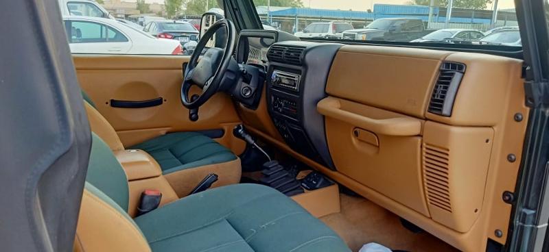 1998 Jeep Wrangler in Ajman, United Arab Emirates | Jeep Wanngler 1998 V6  oily Color  2 doors Very Clean
